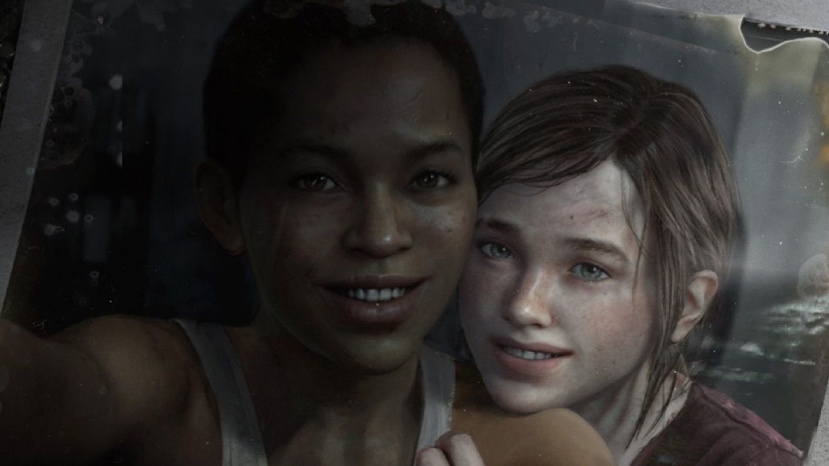 Snapshot of Riley and Ellie from the "Left Behind" DLC (2014). Riley (left) is a Black teenage girl with her black hair pulled back into a ponytail. She's wearing a white tank top and is the one holding the camera. Ellie is a white teenage girl with her brown hair pulled into a ponytail. She's wearing a red shirt as she rests her chin on Riley's shoulder. They're both smiling. 