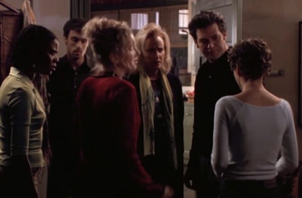 Image of five people questioning Felicity in a scene from "Family Affairs"